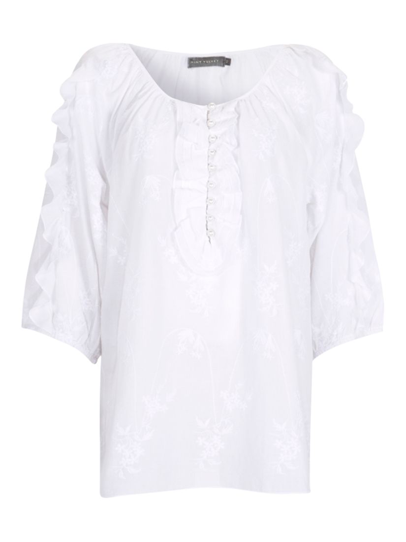 white ruffle blouse